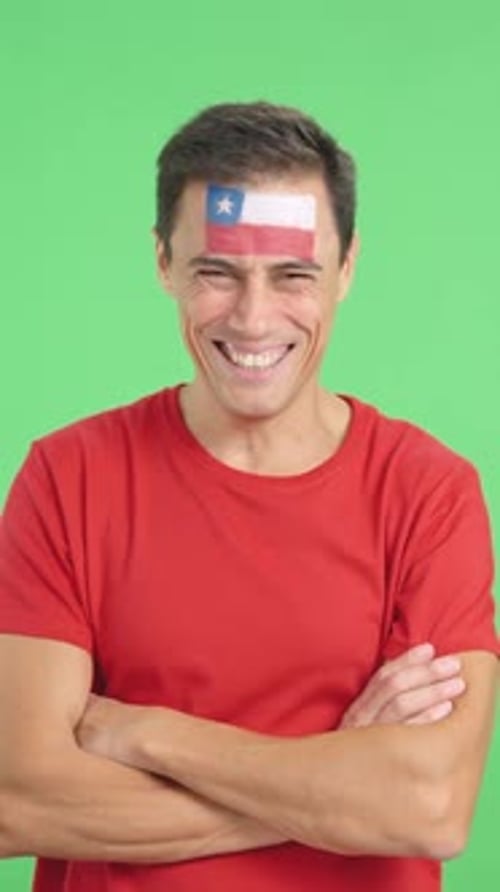 Smiling Man With Flag Painted on Forehead