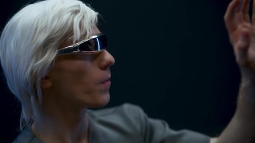 Man with Futuristic Glasses Interacting with Virtual Interface