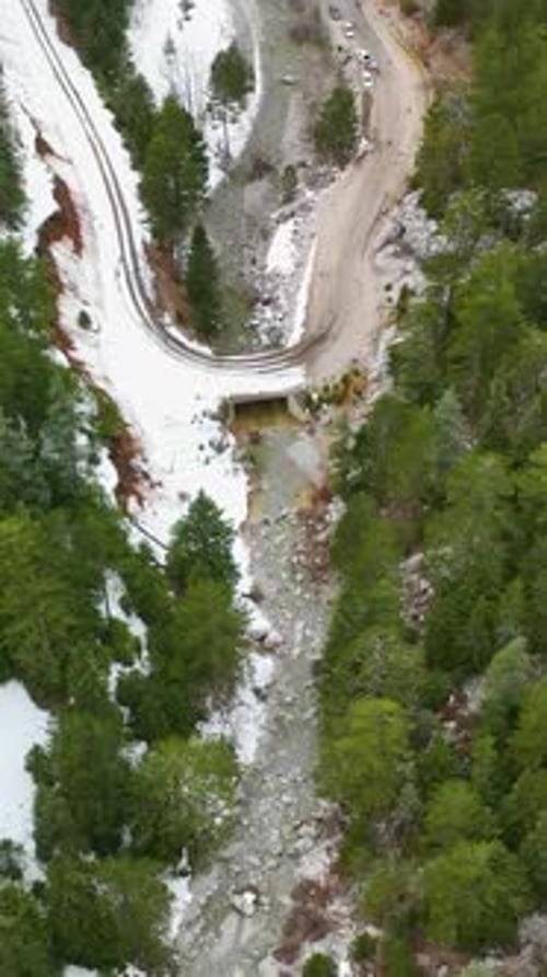 Vertical Video Aerial View Turkish Winter Wonderland Majestic Mountains River and Scenic Waterfalls