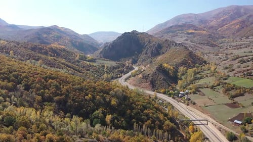 Aerial View Of Colorful Wooded Hills And Highway In Autumn