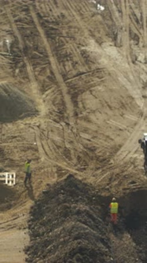 Aerial View of Construction Site and Workers