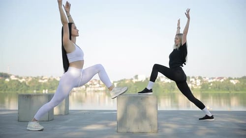 Young Women Doing Aerobics in City Park Outdoors Morning Sports Training