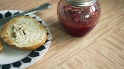 Bagel With Jam Close Up in Home Setting