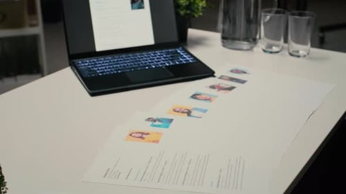 Laptop in Empty Corporate Space Shows Applicant CV Before Hiring Interview