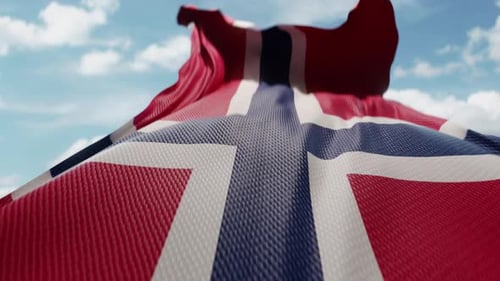 Waving Norway Flag Against a Clear Blue Sky