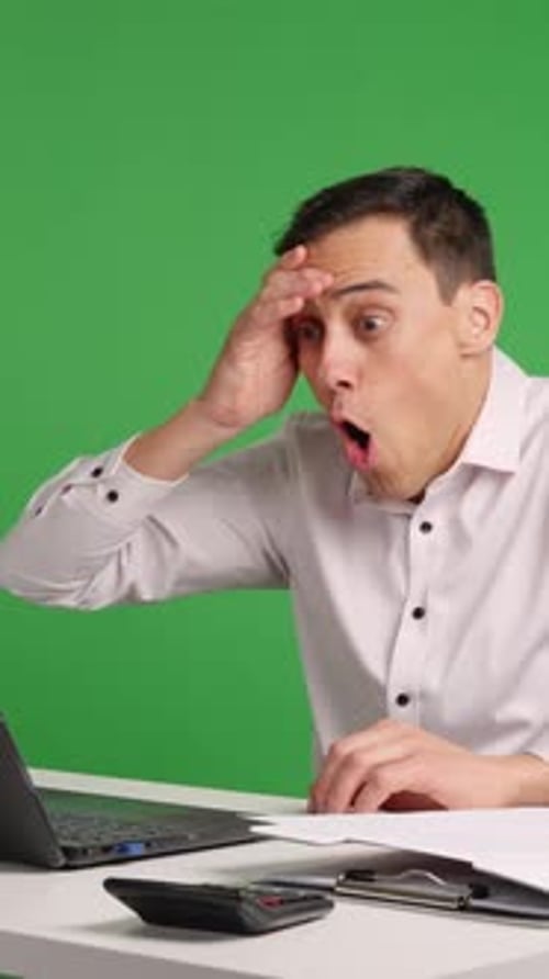 Office Worker Receiving Good News on Laptop with Green Screen