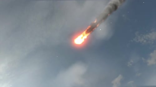 Flaming Meteor Streaking Across Cloudy Sky