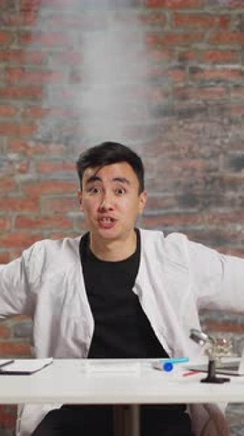 Scientist with Smoke Rising Above Head Angry of Test Fail