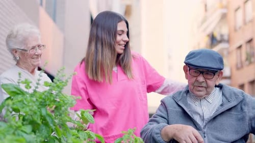 Friendly Caregiver and Senior Patients Outdoors