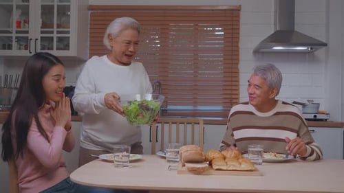 Family Meal with Salad in Home Kitchen