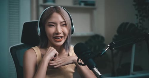 Girl Talking Into Microphone at Home Studio