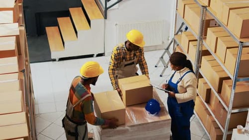 African American People Packing Products in Boxes