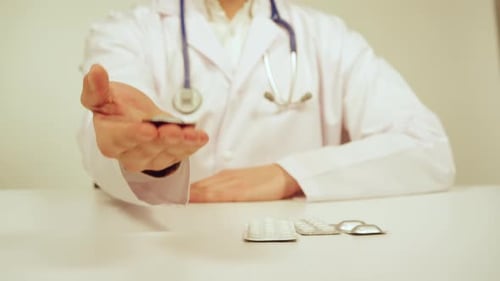 Doctor Giving Medicine to Patient Close Up