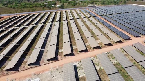 Panoramic overview of renewable energy inverters and very contrasting dirty and clean solar panels