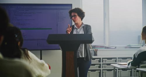 Woman Teaching Coding Class in Classroom