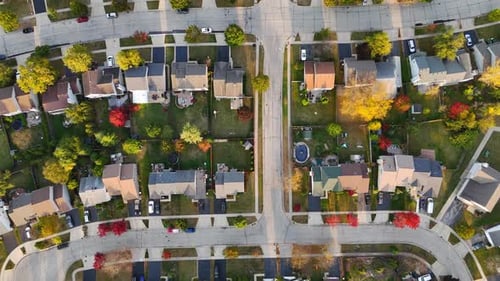 Aerial Top View Picturesque Residential Street with Autumn Colors and Detached Houses A Village in