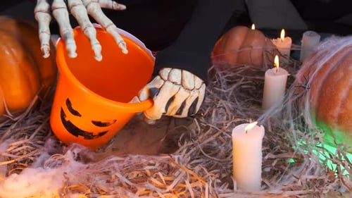 Halloween Bucket Filled with Candy by Spooky Hands