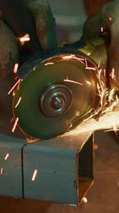 Dynamic Metal Grinding Process Captured in Two Frames Revealing the Intensity of Sparks and Skilled
