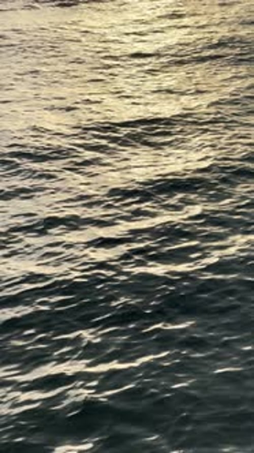 Waves Sparkling with Golden Light at Sunset