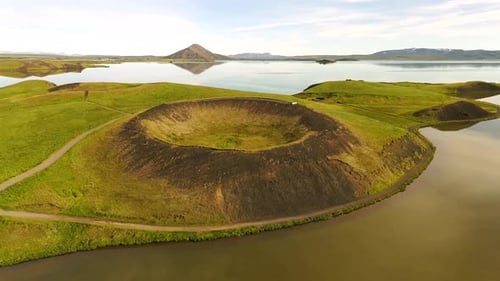 Witness the mesmerizing shapes of Skútustaðagígar from above, where volcanic activity has sculpted a