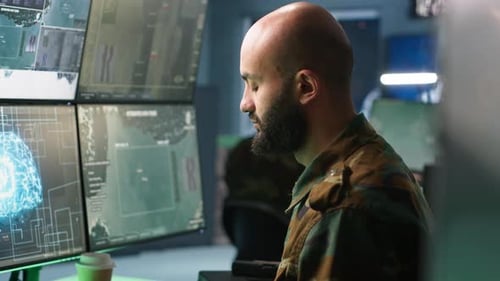 Focused Adult in Futuristic Workplace Analyzing Data