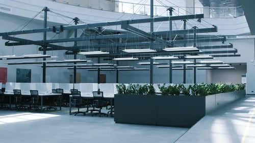 Modern Workplace with Conference Zone and Covered Computers