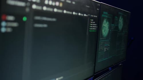 Desk in Empty Criminals Den and Hacking Software Interface on PC Screens