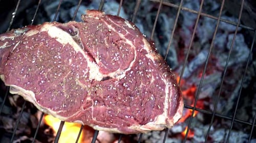 Beef steak cooked on the grill. Grilled steak slices. Cooking food footage.