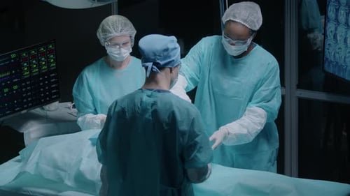 Surgeons Performing Operation in Hospital Operating Room