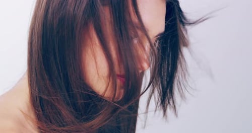 Beautiful Woman with Long Hair Posing in Studio