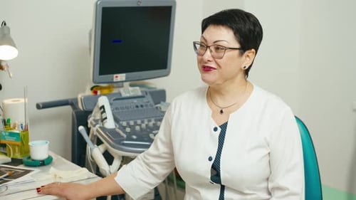Portrait of a Woman Doctor of Ultrasound Diagnostics in the Office