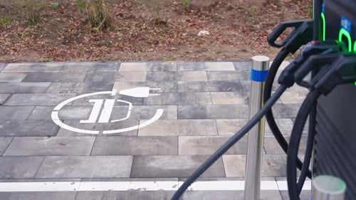 Electric Vehicle Charging Station With Charging Cables