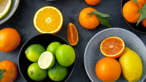 Healthy citrus fruits flat lay overhead view on stone table for vegan diet