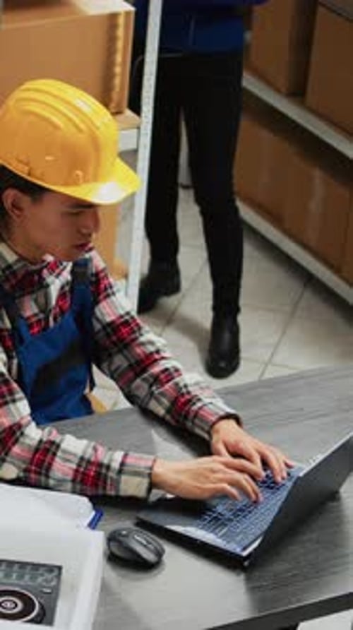 Vertical Video Asian Employee Doing Stock Logistics on Laptop