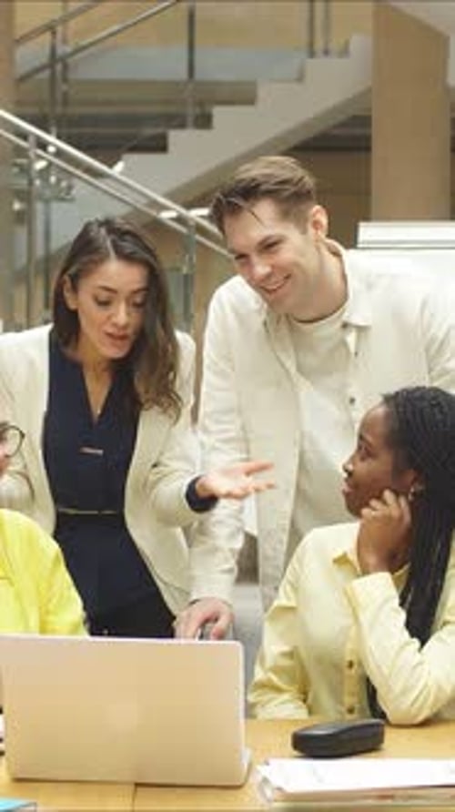 An Engaging and Dynamic Team Meeting Taking Place in a Modern Office Environment Setting