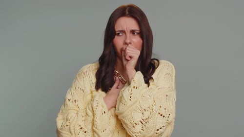 Adult Woman Coughing with a Sore Throat