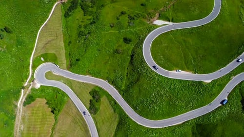 Cars Driving on Winding Road in the Dolomites Aerial View