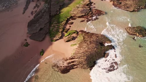 Aerial Beach Waves And Rocks