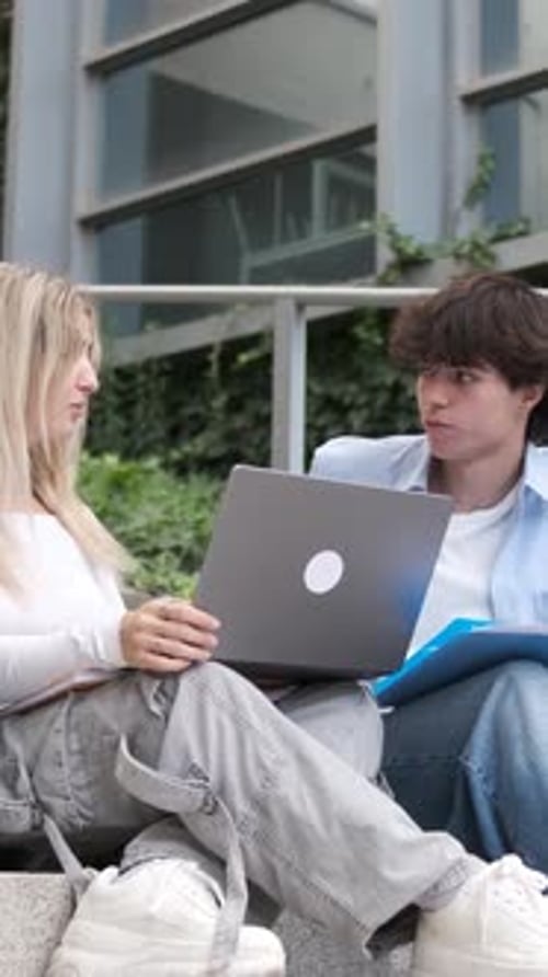 Students Receiving Bad News on Laptop Computer