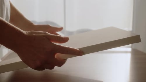 Artist Hold Small White Canvas in Hands