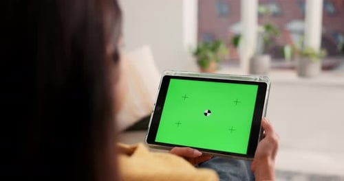 Woman, tablet screen and hands with mockup on sofa for advertising, entertainment or app in home