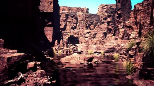 the River Flowing Through the Valley of Huge Red Rocks