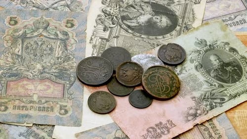 Antique Banknotes and Coins of a Bygone Era