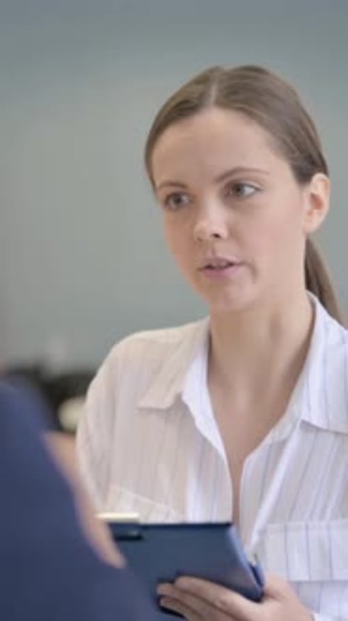 Counselor Helping Upset Businessman sitting in session, vertical video