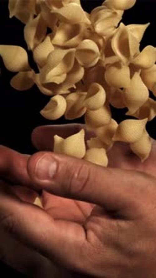 Dry Pasta Flies Up and Falls in your Hands Filmed on a Highspeed Camera at 1000 Fps