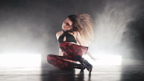 Woman in Sexy Outfit Performs Backward Bend Element of Dance Difficult Trick in Studio with Lamps, People Stock Footage ft. backbend & dance - Envato Woman in Sexy Outfit Performs Backward Bend Element of Dance Difficult Trick in Studio with Lamps, People Stock Footage ft. backbend & dance - Envato