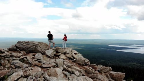 Guy Takes a Picture of a Girl on the Edge of a Cliff