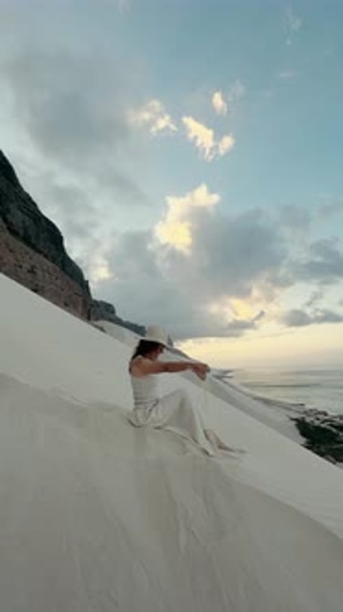 Woman Posing on Sand Dune at Sunrise
