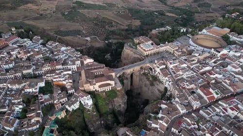 Aerial view of Ronda with historic buildings and scenic valley, Spain.