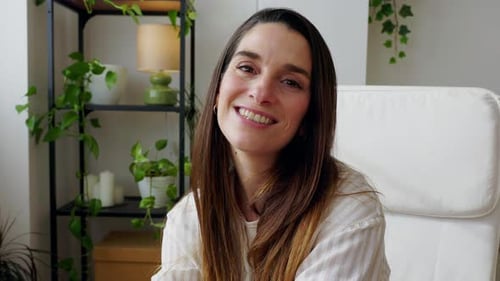 Woman Smiling at Camera Indoors